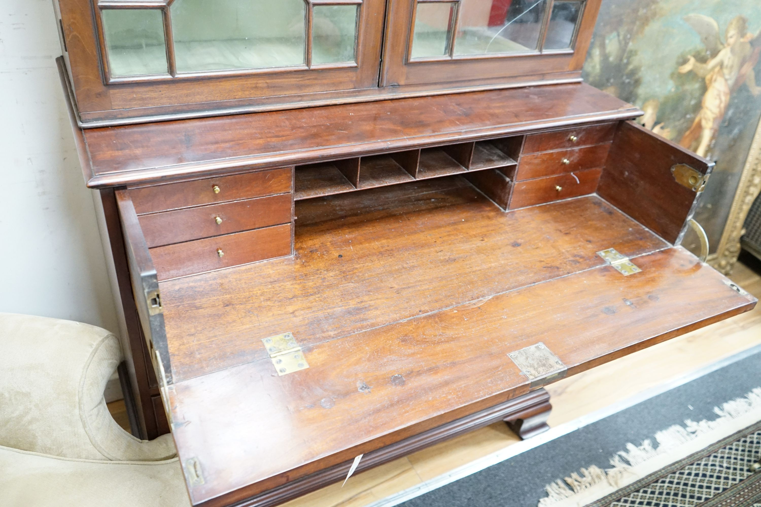 A George III mahogany secretaire bookcase, lacking cornice, width 110cm, depth 58cm, height 216cm